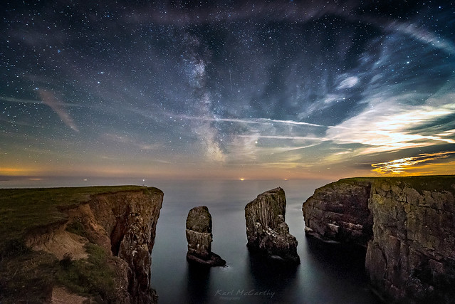 The Moon sets and the Milky Way rises as the Elegug Stacks stand proud