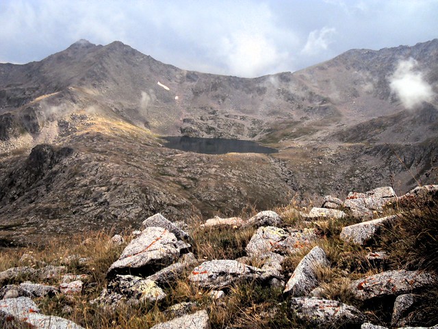 The pass above the lake is the one we came down the day before in the rain. by bryandkeith on flickr