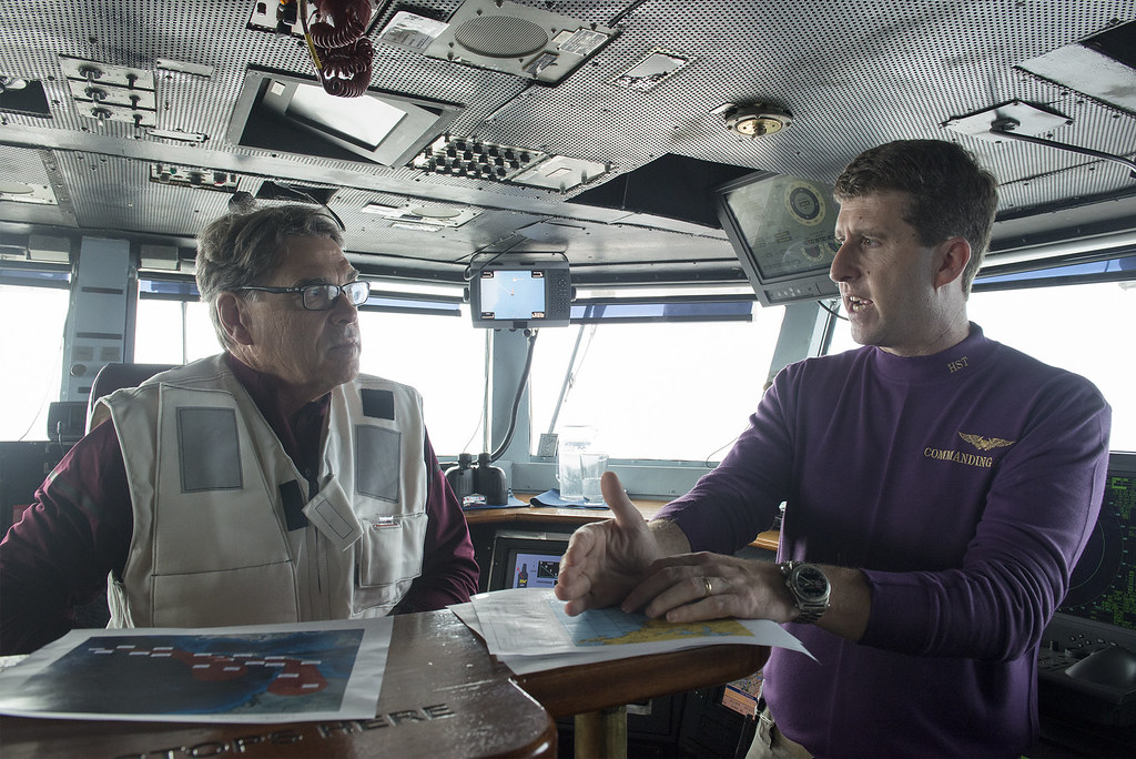 Secretary of Energy Rick Perry, left, discusses Hurricane Irma with Capt. Nicholas Dienna, commanding officer of the USS Harry S. Truman.