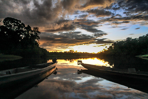 sanilodge ecuador landscape sunset river nature reflection boat yasuninationalpark amazon goldenclouds clouds sucumbios ec