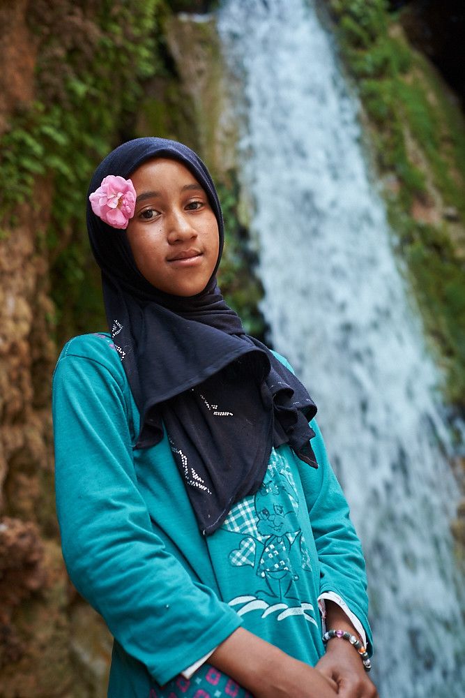 Little moroccan girl at waterfall, Ait Youl, Drâa Valley, Morocco