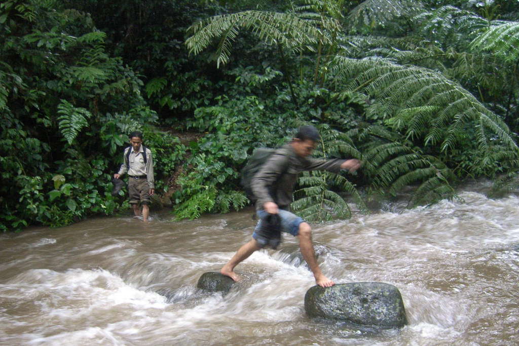 Crossing a fast flowing river in Indonesia.