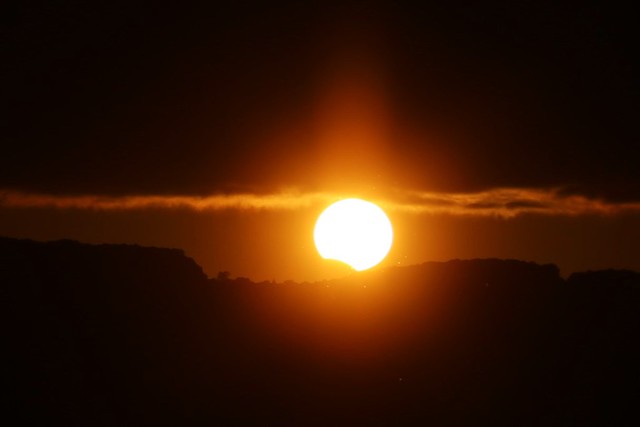 Partial solar eclipse at sunset