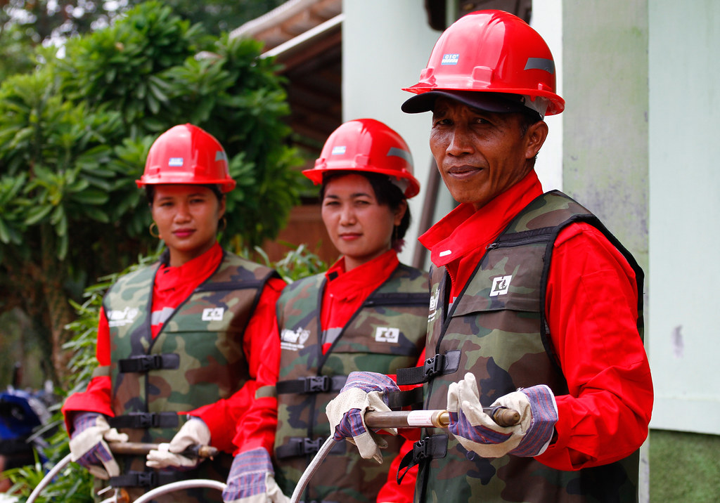 Firefighters ready and posing with a water hose at Garantung village, Palangkaraya, Indonesia.