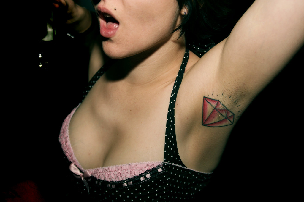 I've never seen a tattoo on an underarm before. party, tattoo, diamond...