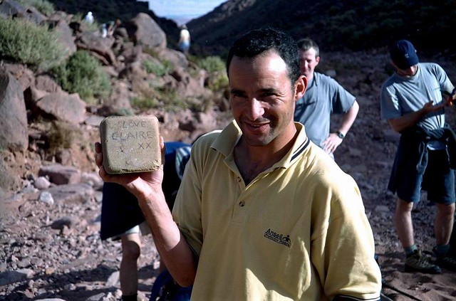 Abdou Discovers a Love Brick from Claire in His Daypack