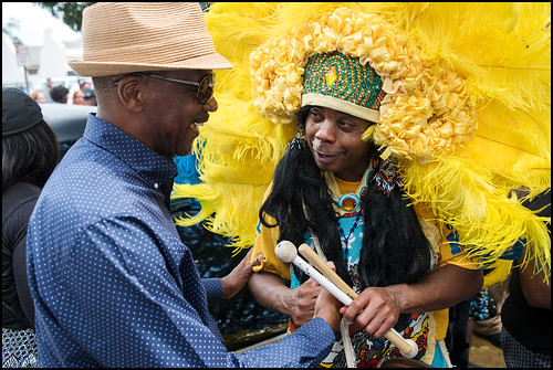 Yellow Pocahontas Big Chief Darryl Montana and Spy Boy Honey say hello during the funeral second line in honor of Big Queen Mercedes 