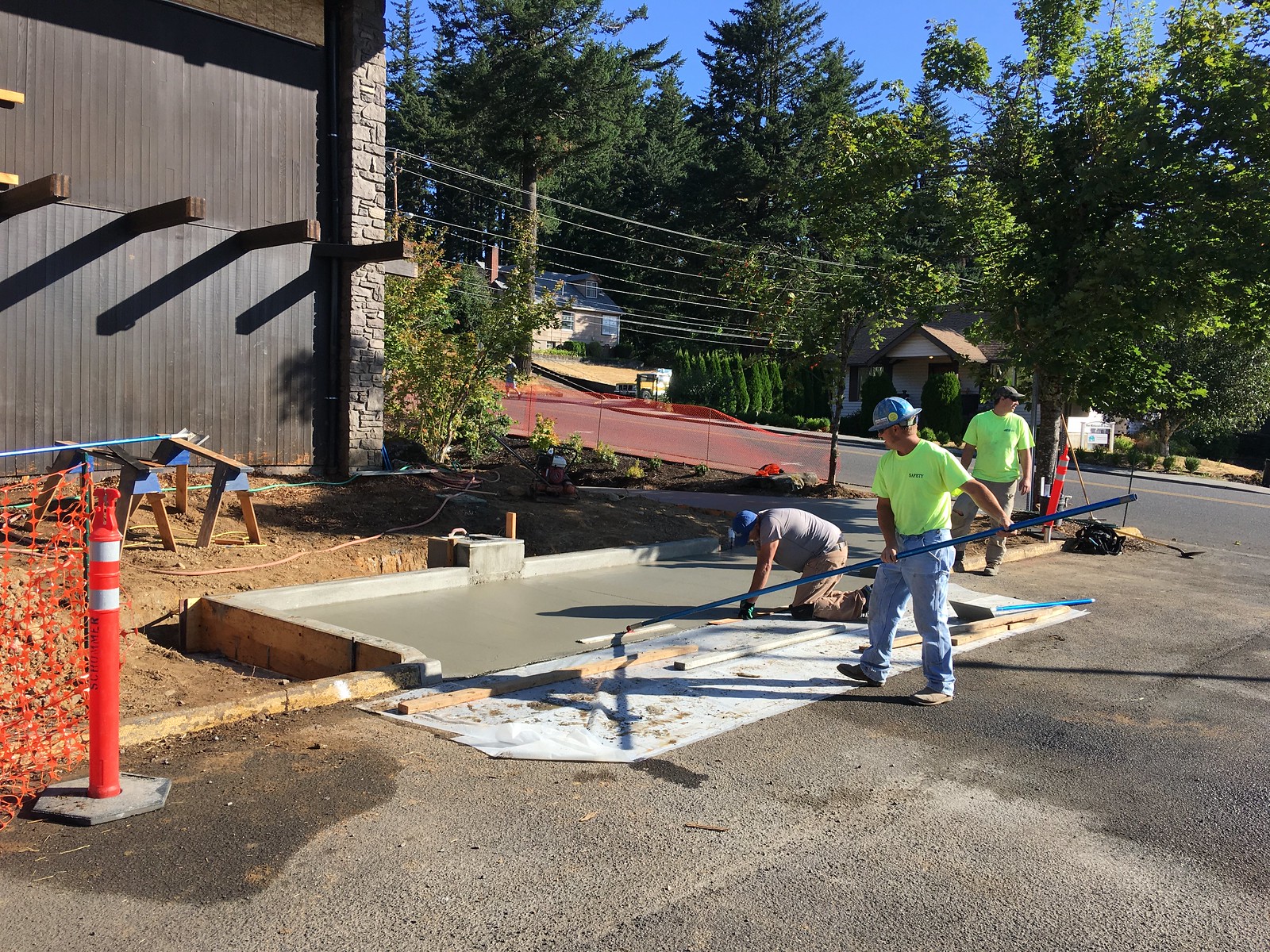 August 16, 2017--Smoothing the new walkway at Stevenson Community Library