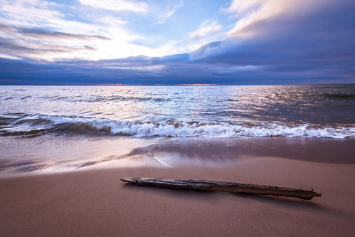 ocean wood sea sky sunlight lake color beach nature water beautiful beauty clouds landscape sand outdoor smooth shoreline peaceful wave nopeople lakemichigan greatlakes driftwood lakeshore serene seashore tranquil refection