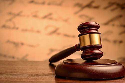 Wooden gavel on a plinth | by Serg Gn