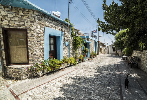 street cyprus island mediterranean town houses house old history historical stones stone door window cat black hot summer outdoor landscape wideangle road