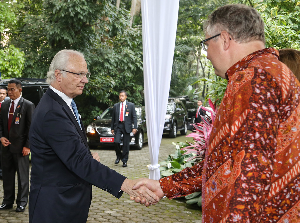 King Carl XVI Gustaf of Sweden, left, is greeted by CIFOR Director General Peter Holmgren upon arrival for his visit...