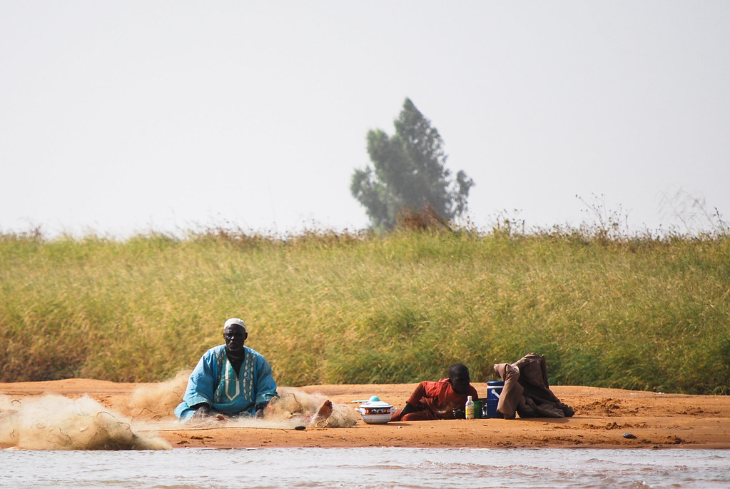 Taking lunch on the river bank, Africa.