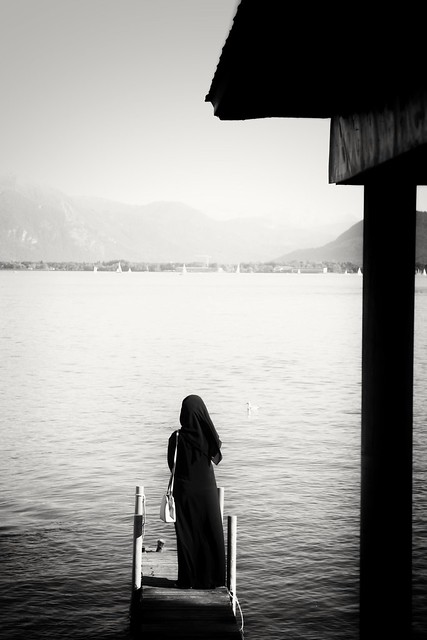 Woman in a burkha by the lake