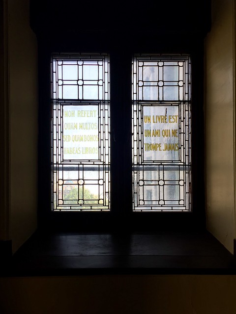 Une livre est un ami qui ne trompe jamais - A book is a friend who never fails you. Side windows in Redpath Hall, the original McGill library reading room. #loose translation