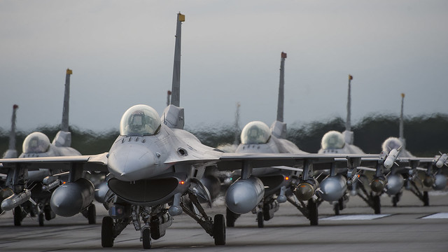 18 F-16's line the runway during elephant walk