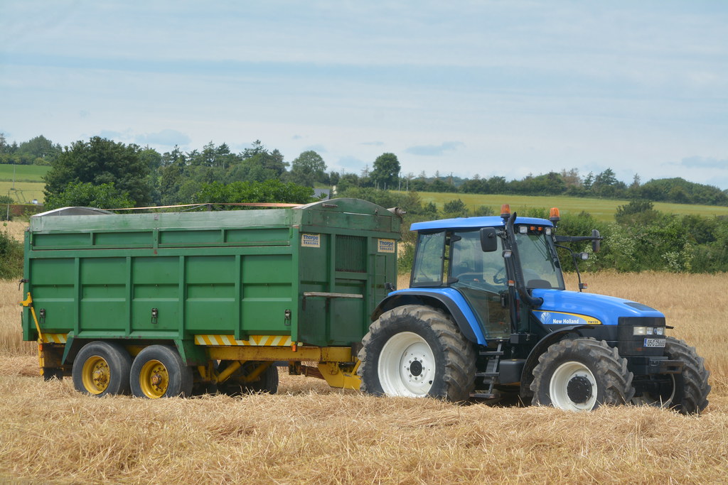 New Holland TM155 Tractor with a Thorpe Grain Trailer