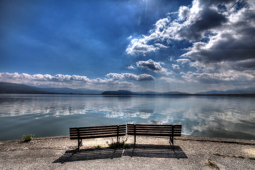 horizontal outdoors nopeople view landscape bench edge lake water serene quiet hdr highdynamicrange sky clouds cloudy weather bluesky reflection mountains shadow light sunlight colour color winter travel travelling march 2017 vacation canon 5dmkii camera photography lakepamvotis island nisi nisakiioanninon europe ioannina epirus greece