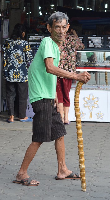 old man with unusual bamboo cane