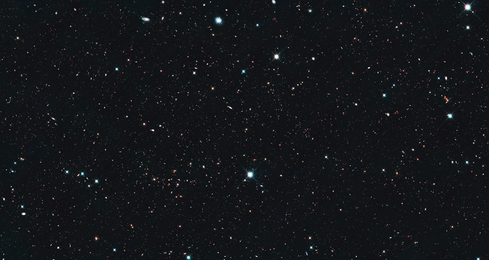 Hubble Uncovers Tiny Galaxies Bursting with Star Birth in Early Universe