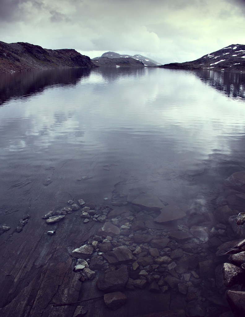 Moutains, reflections, and rocks — Norway