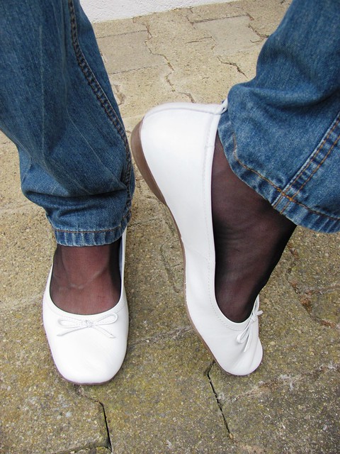 white leather Tamaris ballet flats, nylons and jeans, outdoor shoeplay ...