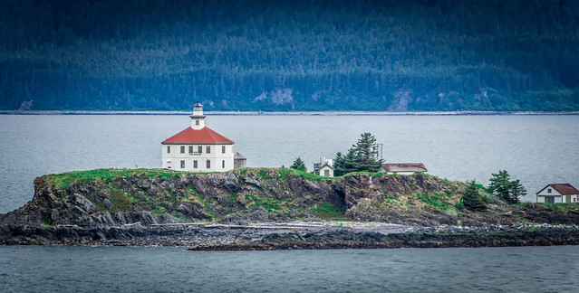 remote lighthouse island standing in the middle of mud bay alaska