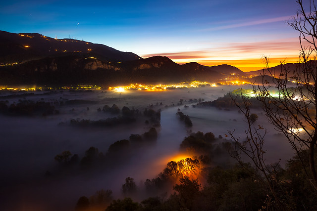 Viewpoint of the Adda river valley during a foggy dawn, Airuno, Italy