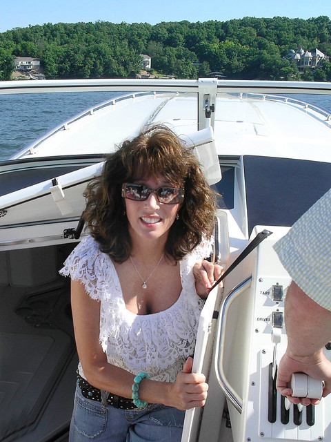 Our daughter, Paige (& hubby's arm) on their boat on the Lake of the Ozarks