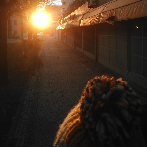 yellow sun suns sunny sunset sunsets person head hat gorro path yellowish walking looking braga portugal europe