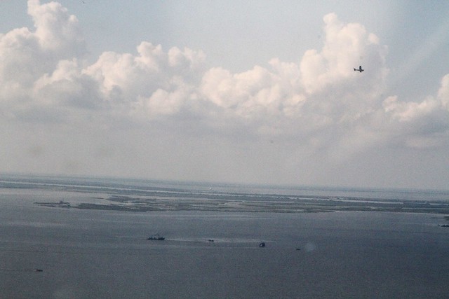 Menhaden Fleet in Breton Sound, with spotter plane