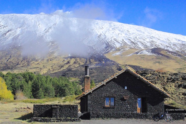 Etna _ shelter at the foot of the snow-capped volcano