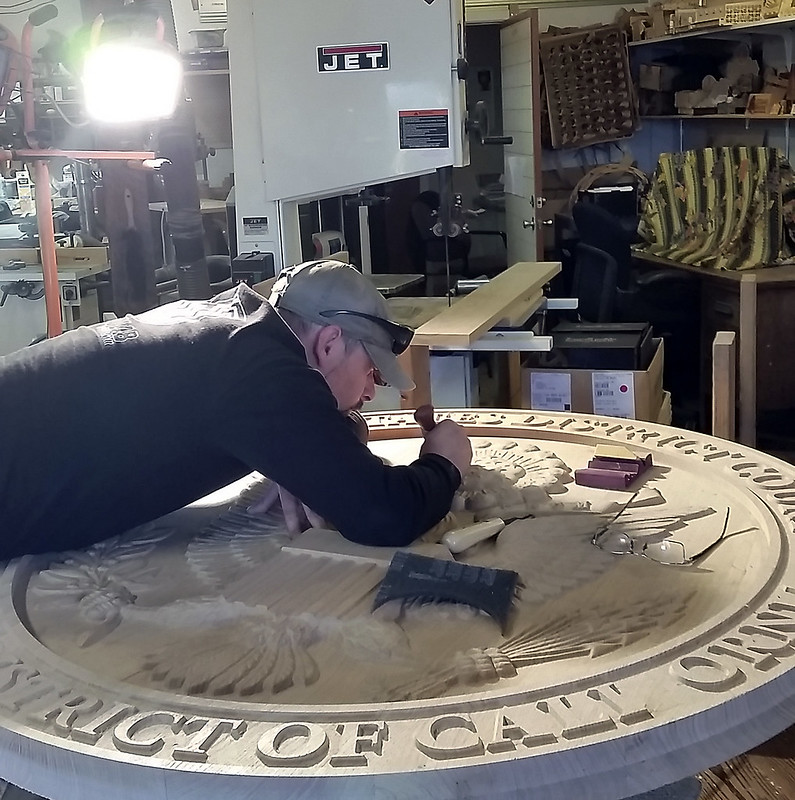 Brad at Woodlab working on the hand-tooling of the US District Court Seal