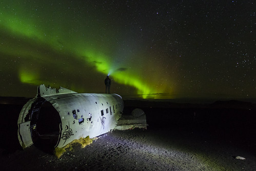 Northern lights, a man, and the old DC-3 which crashed in 1973... | by Amir Hamze