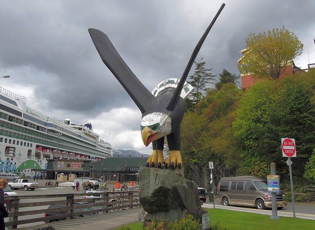 USA (Ketchikan, Alaska) Cruise ship and a bald wooden eagle totem