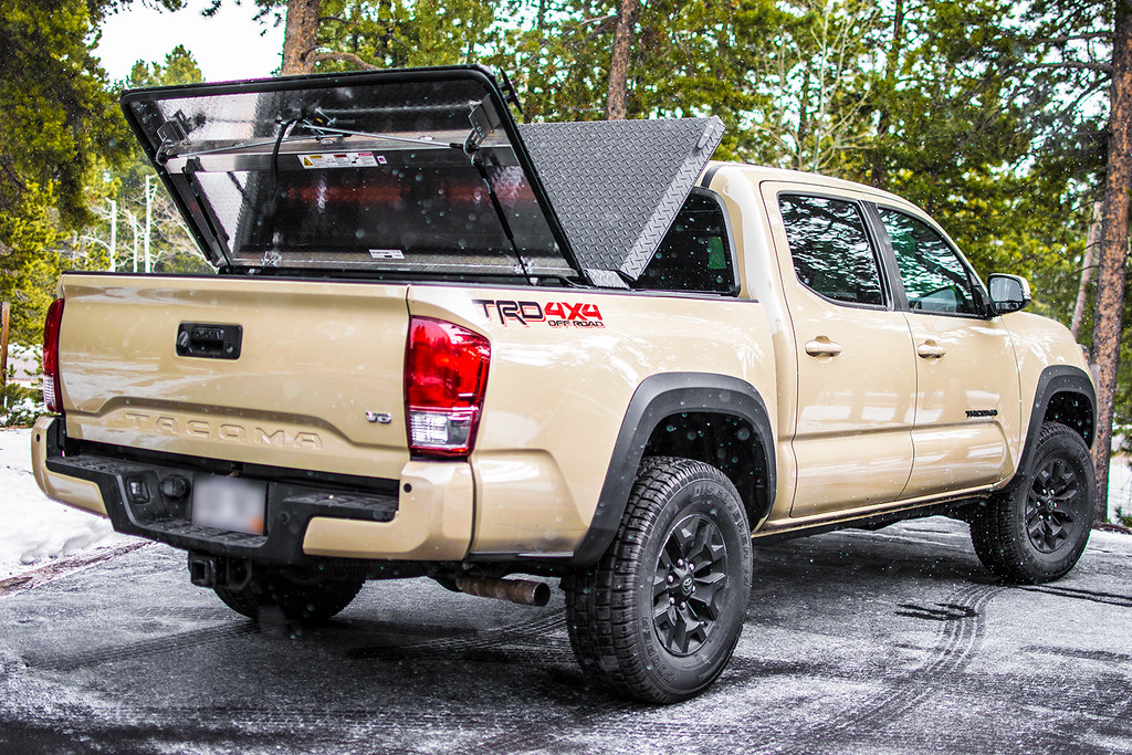 An Aluminum Truck Bed Cover On A Toyota Tacoma.