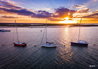 Three boats at sunset