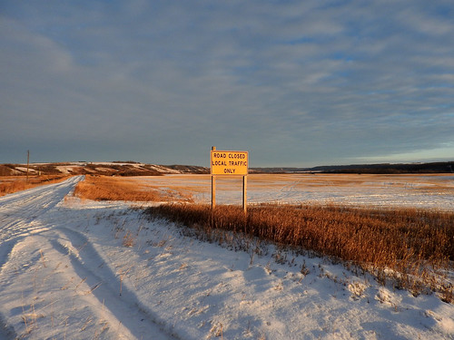 road prairie sign closed grass snow sky