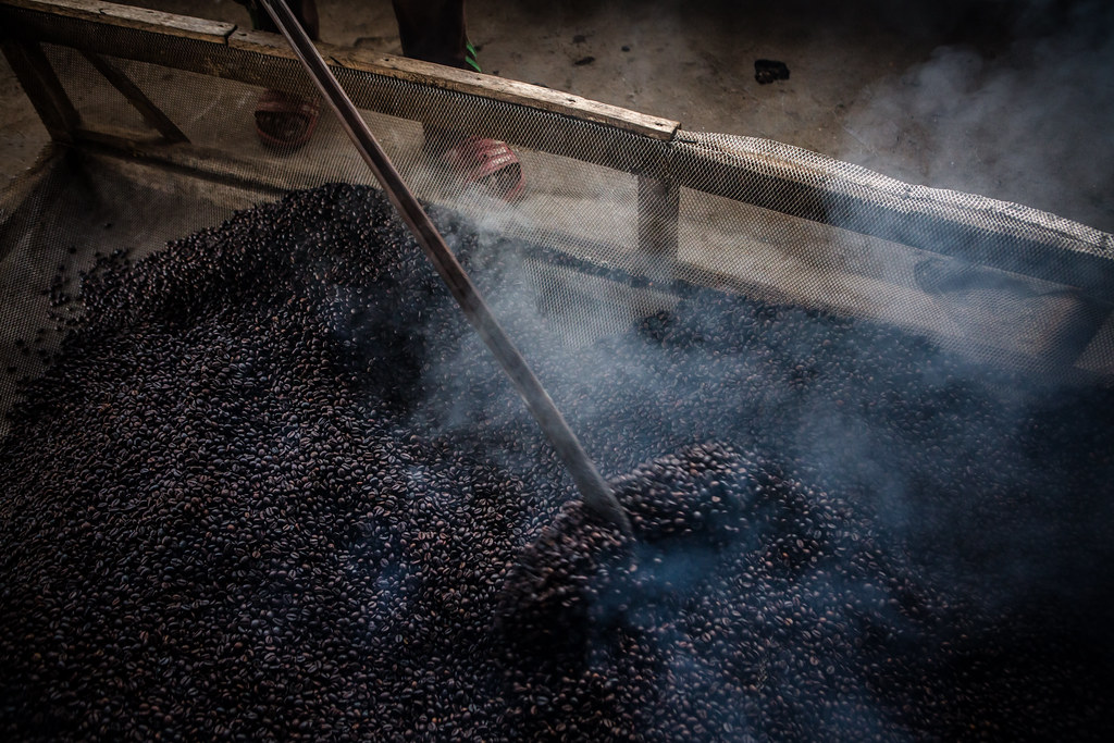 Steam rises from coffee beans just been roasted in Tri Budi Syukur village, West Lampung regency, Lampung province, Indonesia on...