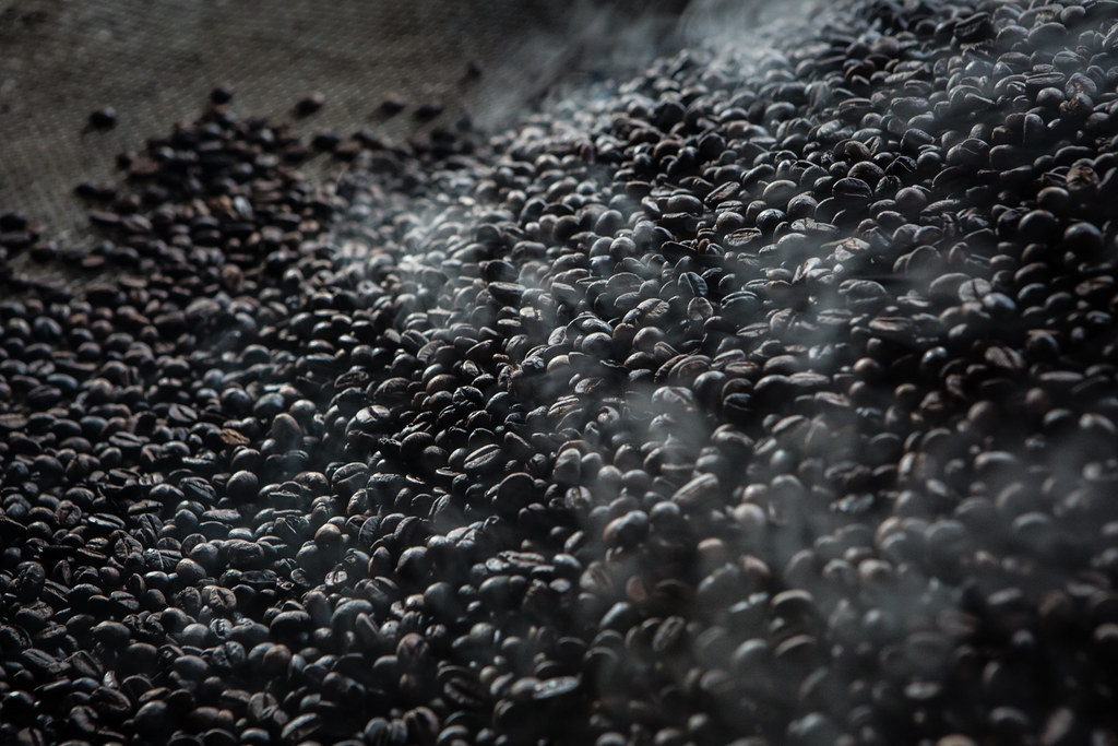 Steam rises from coffee beans just been roasted in Tri Budi Syukur village, West Lampung regency, Lampung province, Indonesia on...