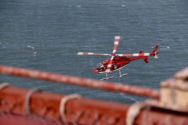 Helicopter going under Golden Gate Bridge