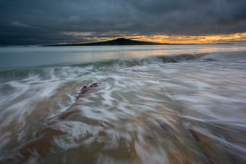 waves water spill flow lapping island volcano rangitoto sunrise golden