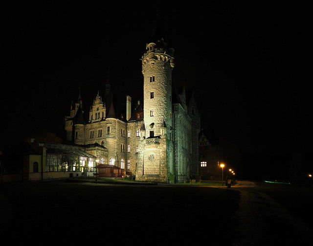 Moszna Castle at night.