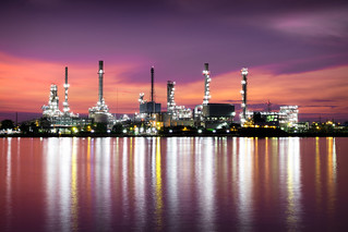 Petrochemical plant area in morning with reflection in river