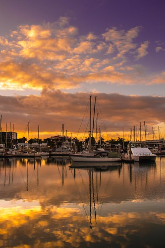 ross creek townsville queensland australia sunrise water reflection clouds boats