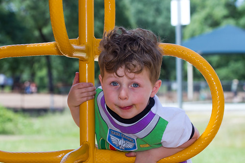 fun park jungle playground gym boy outdoor play kid child outside people young leisure recreation summer climbing childhood activity happy cheerful joy exercise cute enjoy toy vibrant equipment ladder view spring happiness lifestyle children yellow colorful caucasian active color day sunny urban person