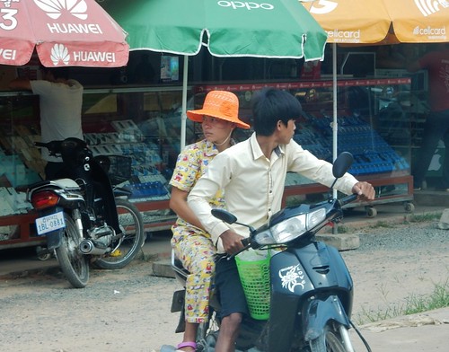 cambodia village motorbike couple pyjamas pajamas fashion attentive careful