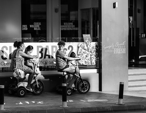 streetphotographing streetview streetlife cityview citylife city cityviews street family riding bike mom dad kids blackwhite bnw bw urban cyprus ayanapa canon6d canonphotography 3wheeler 2017 october onholiday peopleonstreets people peoplephotographing photograph