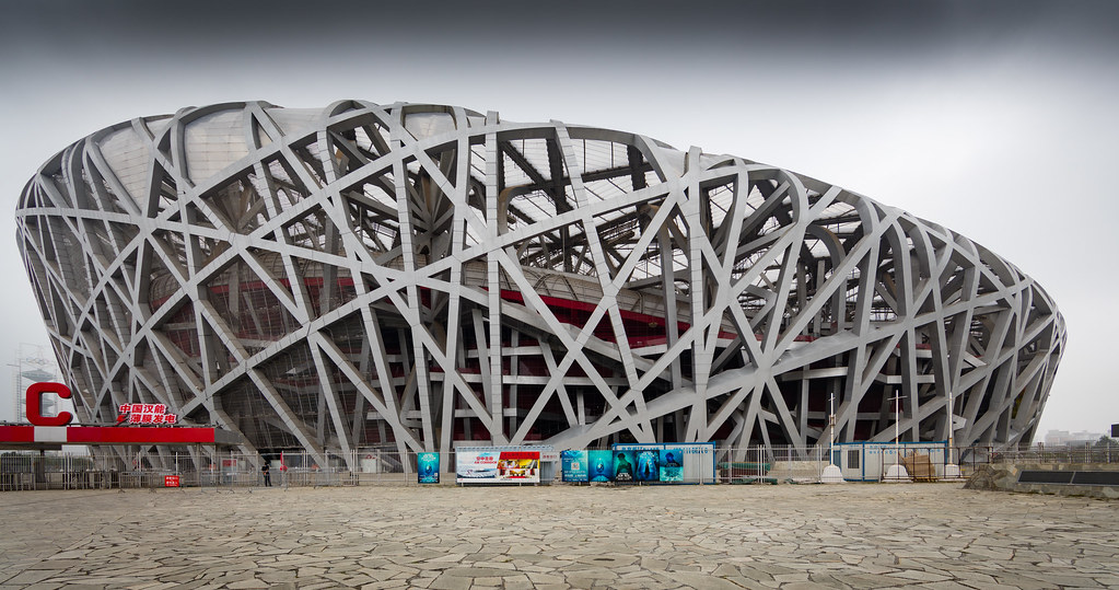 Стадион гнездо. Пекинский национальный стадион Птичье гнездо. Национальный стадион Птичье гнездо в Пекине Китай. Стадион Птичье гнездо в Пекине Архитектор. Стадион Ласточкино гнездо в Пекине.