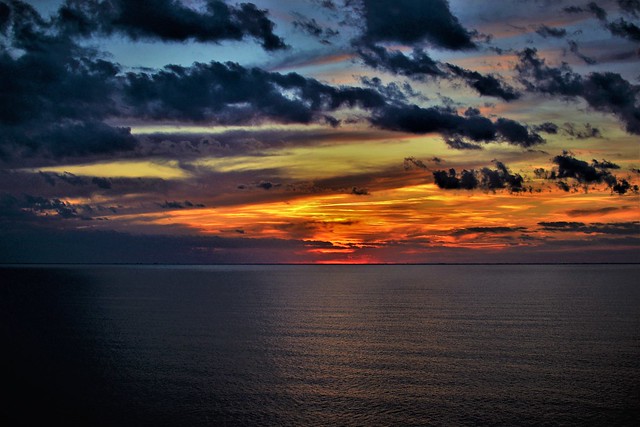 Colorful skies in the open Seas at dusk